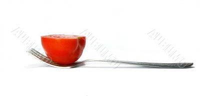 Fork and tomato isolated