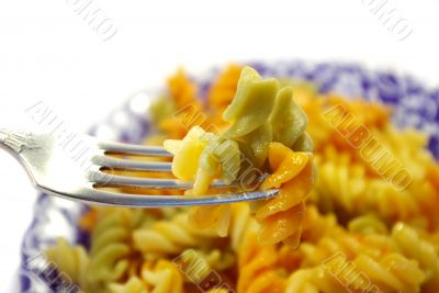 plate of  tricolor macaronis and plug