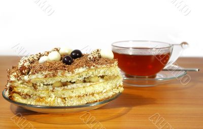Cup of tea, spoon and cake