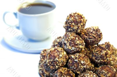 sweets whith nuts and cup of coffee