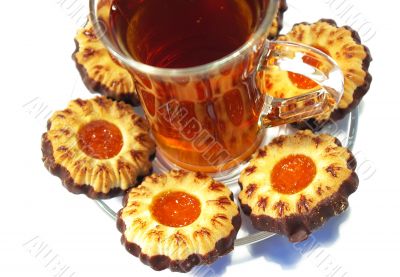 Cookies whith jelly and tea on a white background