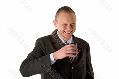 Laughing businessman with cup