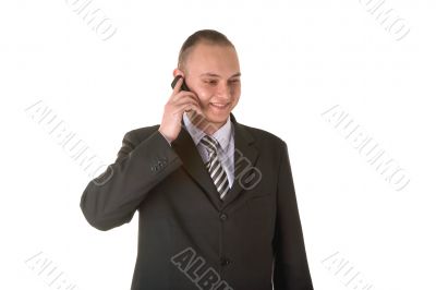 Smiling businessman calling on phone