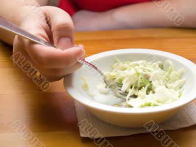 Woman eating salad