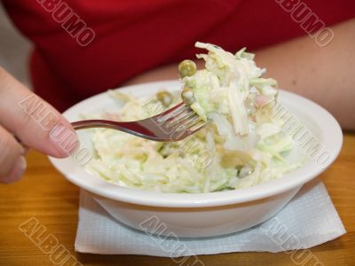 Woman eating salad