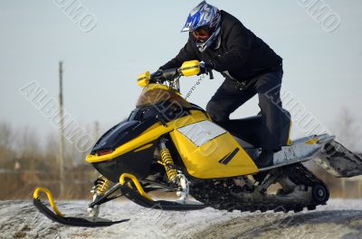 Flying of ski mobile rider