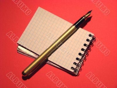 pen and opened notebook