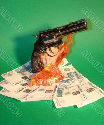 Money, a hand, a revolver