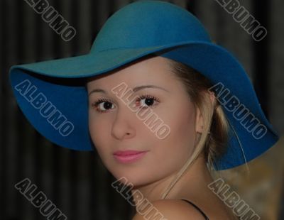 pretty woman in blue hat
