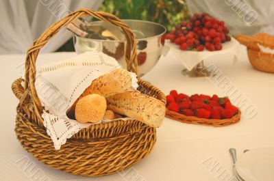 Table setting with bread basket and wine bottles