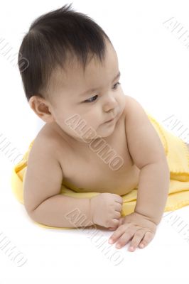 Sweet baby with a yellow blanket