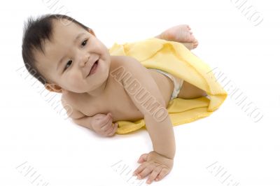 Sweet baby with a yellow blanket
