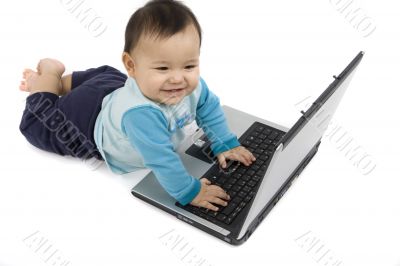 sweet baby with laptop