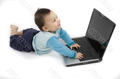 sweet baby with laptop