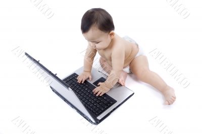 sweet baby with laptop