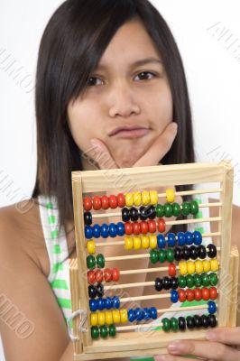 Teenager with calculator
