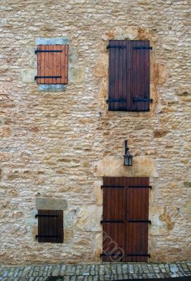 The closed windows, doors and shutters