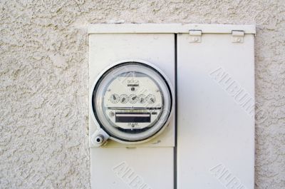 Electric Meter on Stucco Wall