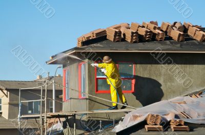 Construction Worker Pressure Washes