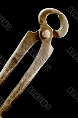 round pliers on black