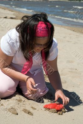Girl Making Sand Sculpture