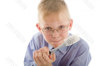 Boy holding brush and prepare to clean everywhere