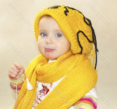 little  girl, yellow cap and scarf