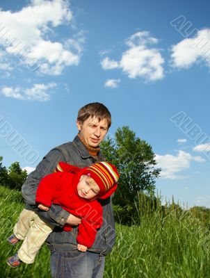 Father holds small daughter
