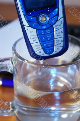 Mobile phone in a  glass of water