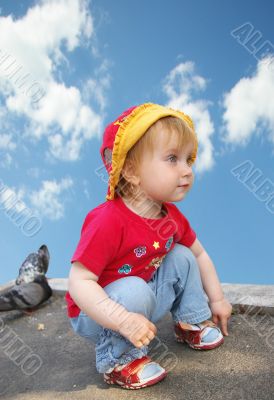 Little girl and pigeons