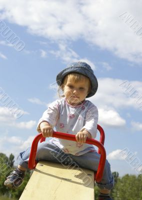 Cute girl swinging in the park