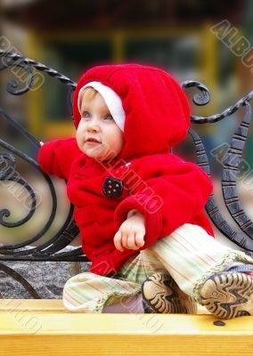 Little girl on a bench