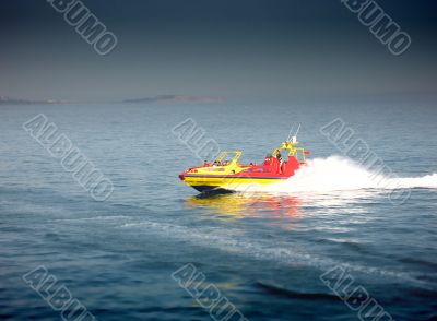 powerboat crossing a wake