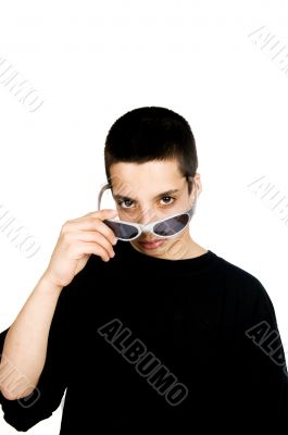 teenage boy is putting sunglasses on