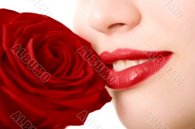 Close-up of beautiful girl with red rose