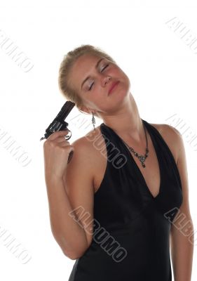 young blond woman in black dress with revolver isolated on white background