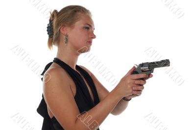 young blond woman in black dress with revolver isolated on white background