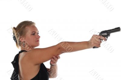 young blond woman in black dress with revolver isolated on white background