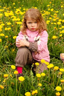 pretty girl in dandelions