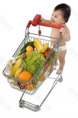 Baby pushes a shopping cart