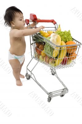 Baby pushes a shopping cart
