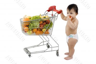 Baby pushes a shopping cart