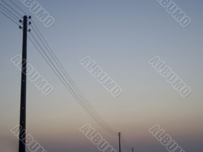 electrical masts at sunrise