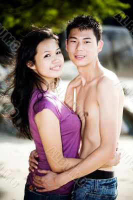 loving couple hugging each other on the beach