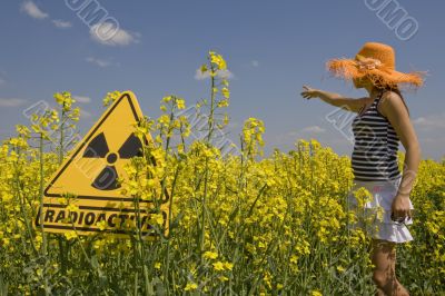 rape field with sign radio-active