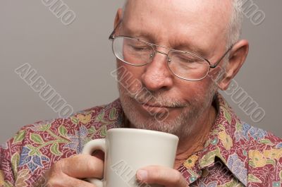 Senior Man Enjoys His Coffee