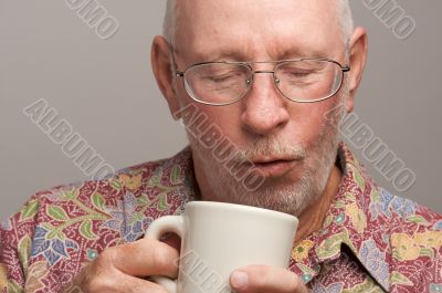 Senior Man Enjoys His Coffee