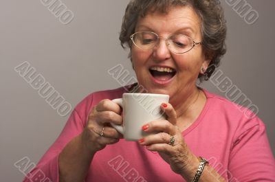 Senior Woman Enjoys Her Coffee