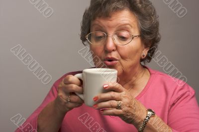 Senior Woman Enjoys Her Coffee