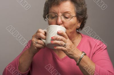 Senior Woman Enjoys Her Coffee